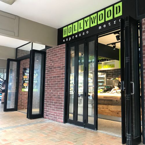 Hollywood Espresso Metro cafe entrance with open glass doors.