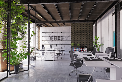 Modern office with biophilic design, featuring plants and open workspace.