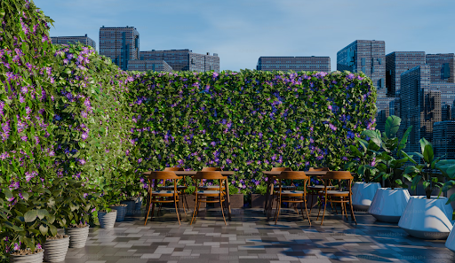 Rooftop patio with green wall, wooden tables, and city skyline.